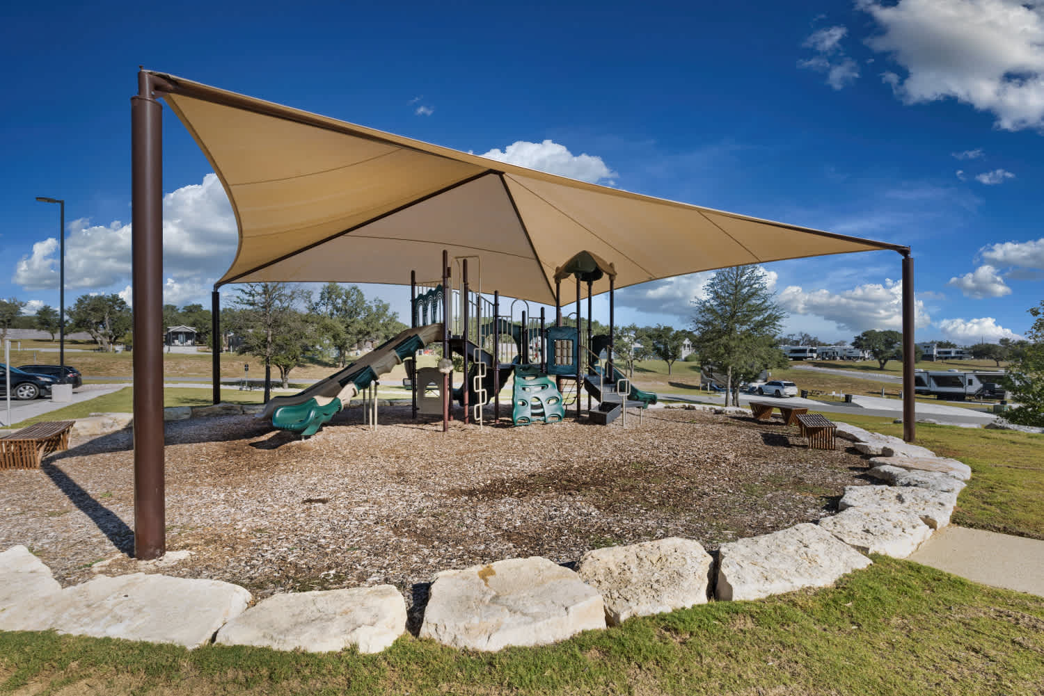 Shaded playground with slides