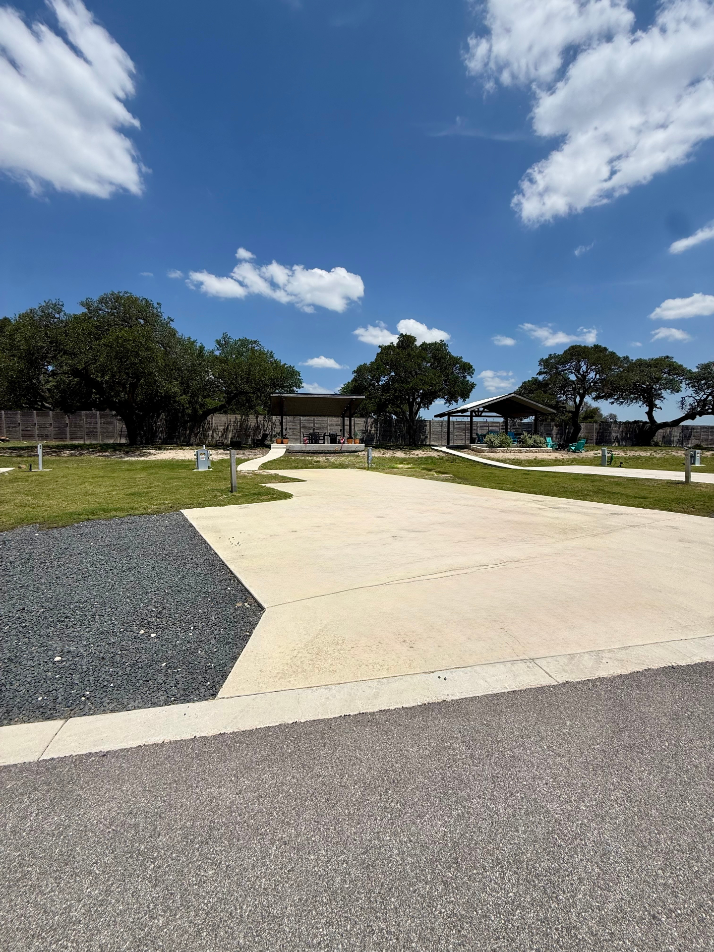 Wide view of the concrete RV pad and covered pavilion at Site 062